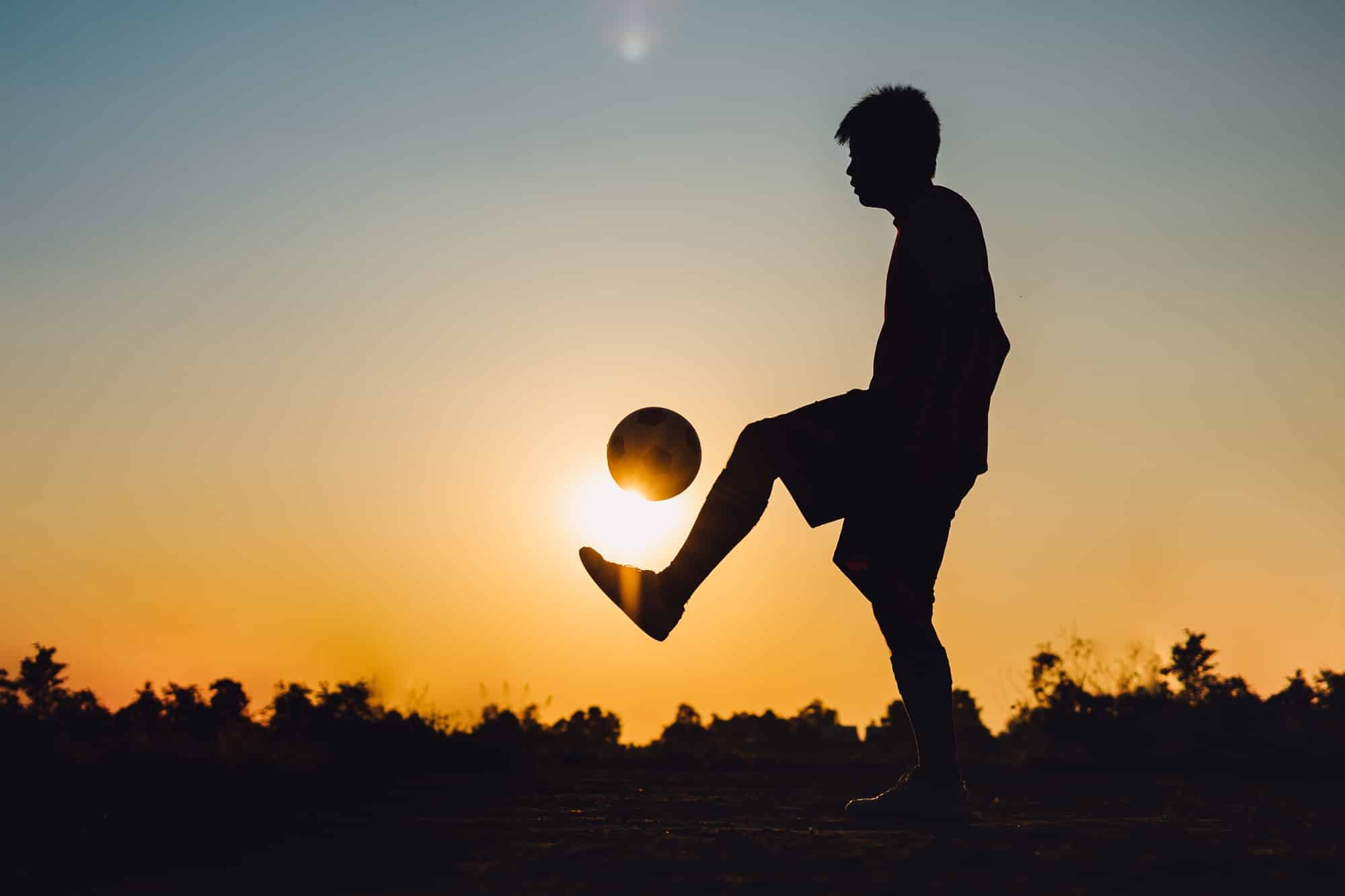 Silhouette soccer football player